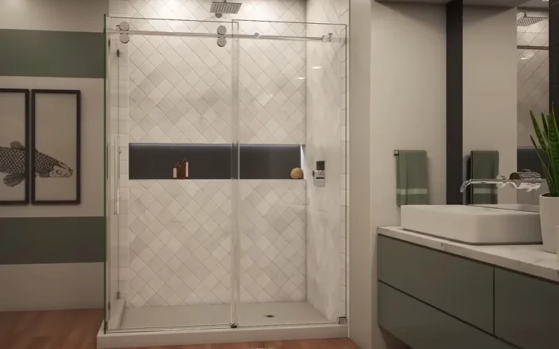 Professional shower door installers Allentown PA bathroom with frameless sliding glass door, diagonal white tile, sage green vanity, and niche